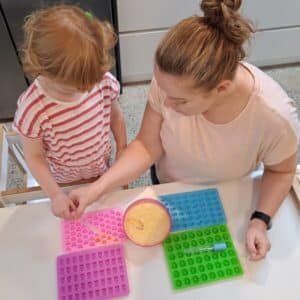 Busy Families Nutrition - Clinical nutritionist Rachel and a young child making healthy gummies