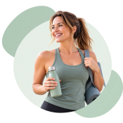 Smiling Woman with Yoga Mat and Bottle